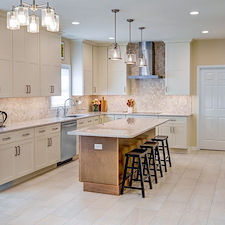 Warm Creamy White Painted Cabinetry Paired With Organic Wood-Grained Timber Kitchen Remodel in East York